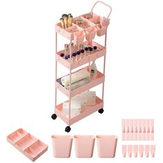 a pink cart with lots of items on it and some cups in front of it