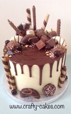 a cake with chocolate and candy toppings on it