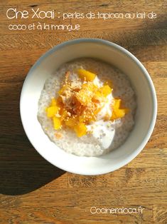 a white bowl filled with oatmeal and topped with oranges on top