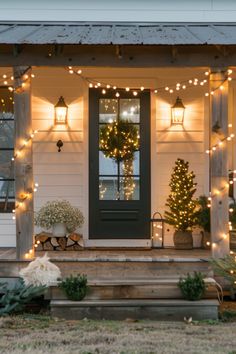 a porch decorated with christmas lights and wreaths