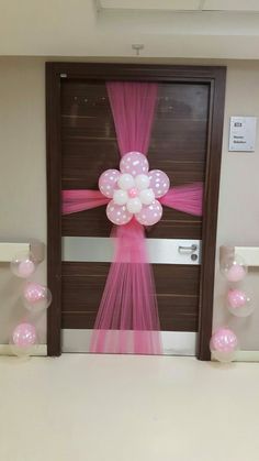 a door decorated with balloons and streamers