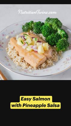 a white plate topped with rice and broccoli next to a piece of fish