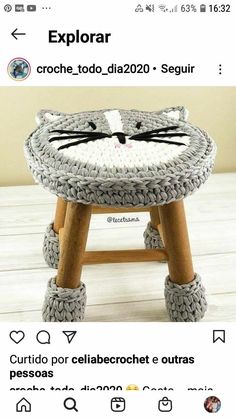 a cat stool made out of yarn and wooden legs