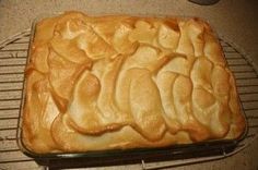 a cake sitting on top of a cooling rack