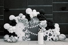 mickey mouse balloon arch with black and white balloons