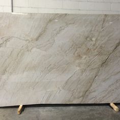 a large white marble slab sitting on top of a floor