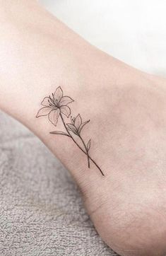 a small flower tattoo on the ankle is one of the most popular tattoos for women