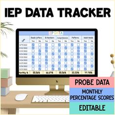 a computer monitor sitting on top of a desk next to a keyboard and mouse with the words iep data tracker above it