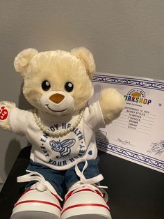 a teddy bear sitting on top of a desk