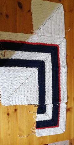 two crocheted rugs sitting on top of a wooden floor next to each other