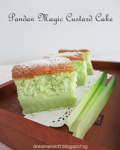 two pieces of cake sitting on top of a wooden tray