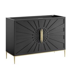 a black cabinet with gold handles and an intricate design