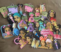 the brown skinned girl is surrounded by many different princesses and tiaras on her head