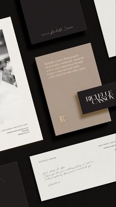 the black and white wedding stationery is laid out