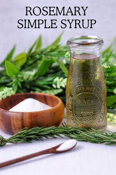 Green Rosemary simple syrup in a jar, wood bowl of sugar, green floral behind Rosemary Cocktail, Preserving Herbs, Cocktail Ideas