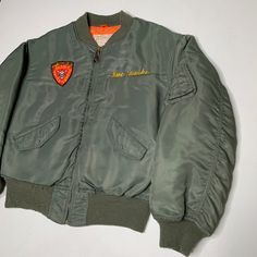 Vietnam era MA-1 bomber jacket by Houston. Tour embroidered front and back 3rd Recon Battalion. Named C W Monke, Don Monke on chest, implies that the soldier was a doctor. Condition is good, the embroidery is bright and in the style of Okinawa There is moth damage on the hem ribbing, see image details. Chest-24 Length-26 Sleeve to shoulder-24 Shoulder-20 The Soldier, Dream Jeans, Vintage Levis 501, Tacoma Wa, A Doctor, 1980s Vintage, Okinawa, Vintage Levis, Moth