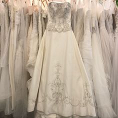 wedding gowns are on display in a store