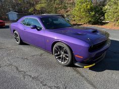 This vehicle is equipped with a HEMI 6.4L V8 engine that delivers an impressive 485 horsepower and 475 ft. lbs. of torque and equipped with the 6 Speed Manual Transmission. The exterior of this model is finished in Plum Crazy Purple color, while the interior is Black. With only 117 miles on the odometer, this Challenger is practically brand new. Davis4x4.com