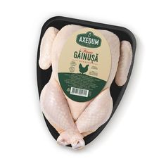 an image of raw chicken in a black tray on a white background with the label