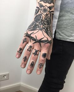 a person's hand with tattoos on it and the words instagram written in different languages