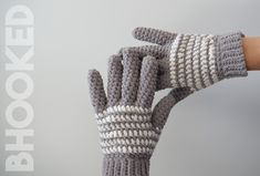 someone is holding their hand up to show off the knitted mitts that they are made from