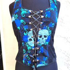 Jawbreaker Xl Nwot. Rockerbilly Black Skull Lace With Blue And Blue Skulls, Blue Spider Webs And Roses Print. Corset Back And Zipper Neck. Zipper Front. Measures 16" Across Chest Shoulder To Bottom 21" Edgy Sleeveless Vest For Halloween, Fitted Edgy Vest For Halloween, Edgy Fitted Vest For Halloween, Fitted Gothic Vest For Halloween, Gothic Sleeveless Top With Skull Print, Rocker Sleeveless Vest For Concerts, Sleeveless Halloween Festival Vest, Halloween Festival Sleeveless Vest, Sleeveless Rocker Vest For Concerts