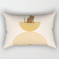 a rectangular pillow with an image of a cat sitting in a bowl on top of it