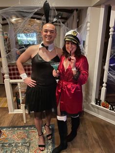 a man and woman dressed up in costumes