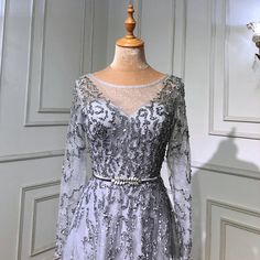 a dress on a mannequin in front of a wall