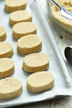 some cookies are on a baking sheet and ready to go into the oven in the oven