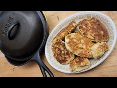 some food is sitting on a plate next to a skillet