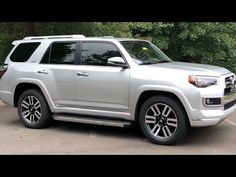 a silver toyota suv parked in a parking lot