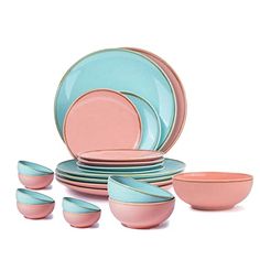 a set of pink and blue dishes on a white background