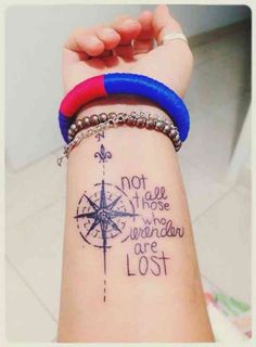 a woman's arm with a tattoo on it that says not all those who wander are lost