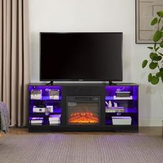 a living room with a television and fireplace