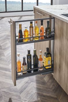 an open cabinet with liquor bottles in it