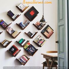 the bookshelves are arranged on the wall