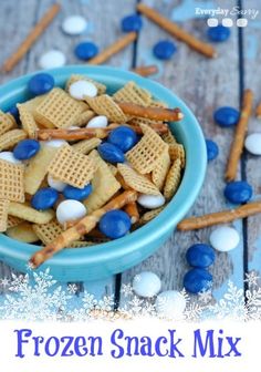 a blue bowl filled with frozen snack mix