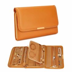 an orange purse is open and sitting on a white surface with other items in it