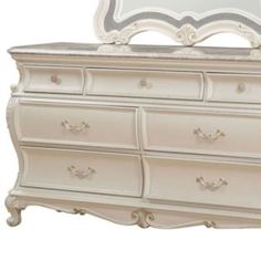 a white dresser with a mirror on it's top and bottom drawer, in front of a white background