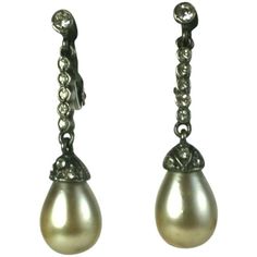 Elegant French Art Deco sterling silver and crystal paste articulated drop earrings with faux tear drop pearls. 1920's Germany. Clip back fittings. Excellent Condition. Length 1..50" Width .25"