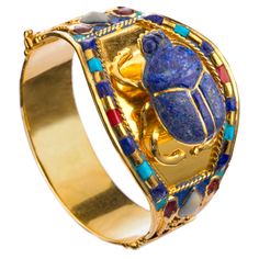 Scarab 24k Golden Plated Bracelet From Ancient Egyptian King Tutankhamun Collection Adornments Held Great Importance In Ancient Egyptian Society, With Jewelry Being An Integral Part Of Their Culture And Traditions. The Scarab Beetle Was A Common Piece Of Jewelry In Ancient Egypt, With The Color Blue Symbolizing The Sunrise And Renewal. These Archaeological Pieces Reflect The Richness Of Ancient Egyptian Culture And The Depth Of Their Spiritual And Artistic Thinking. The Original Pieces Were Made Gringotts Vault, Egyptian Bracelet, King Tutankhamun, Egyptian King, Ancient Egyptian Jewelry, Egyptian Kings, Scarab Bracelet, The Color Blue, Scarab Beetle