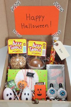 an open box filled with halloween treats