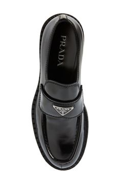 Prada's iconic triangular logo shines on a brushed-leather loafer tastefully updated with a ridged welt resembling tiny chocolate bars. Leather upper and lining/rubber sole Made in Italy Men's Designer Shoes Luxury Glossy Loafers For Formal Occasions, Luxury Glossy Finish Loafers For Formal Occasions, Luxury Glossy Finish Loafers For Formal Events, Luxury Glossy Finish Formal Loafers, Classic Glossy Business Loafers, Classic Glossy Finish Business Loafers, Classic Leather Loafers With Glossy Finish, Classic Glossy Leather Loafers, Business Leather Loafers With Glossy Finish