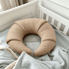 a pillow that is on top of a bed