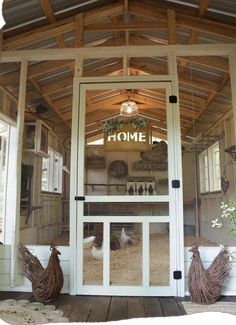 the inside of a chicken coop with chickens in it