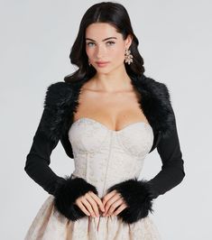 This bolero is the perfect piece for a sophisticated, exclusive look! Designed on smooth rib knit fabric, this is a fashion staple you'll adore featuring fitted long sleeves with plush faux fur cuffs and collar neckline, an open front design, and an ultra-cropped hem. Complete the look with a glitter clutch for a holiday party or black tie soiree!Fit & FeaturesFitted long sleeves, plush faux fur cuffsPlush faux fur collar necklineOpen front designUltra-cropped hemSmooth rib knit fabric, mode Court Outfits, Dress With Fur, Faux Fur Bolero, Dress With Bolero, Night Engagement, Dress Satin Bridesmaid, Backless Dress Short, Sleeve Bolero, Outfit Ideas 2024