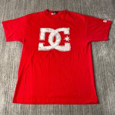 Vintage 2000s DC Shoe Skater Basic Essential Streetwear Y2K Aesthetic Summer Spring Red Graphic T Shirt Large Mens Condition: Fair Used Condition = Has cracking on the graphic due to wear and age. Measurements: Please see photos above for all measurements IF YOU BUY TWO OR MORE ITEMS USE THE CODE BUNDLE @ CHECK TO SAVE 20% WE SHIP WITHIN 24 HOURS AFTER PURCHASE! Please be aware that we do not offer free returns!! The Buyer is responsible for the cost of the return label.  Follow us on TikTok & Instagram @findsnostalgic and tag us in your finds Cheap Red Y2k Style T-shirt, Affordable Red Streetwear Shirt, Red Y2k T-shirt For Streetwear, Red Y2k Streetwear Top, Cheap Y2k Style Men's T-shirt, Aesthetic 2000s, Spring Red, Streetwear Y2k, Dc Shoes