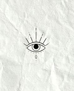 an eye drawn on top of a piece of paper