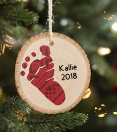 a wooden ornament hanging from a christmas tree